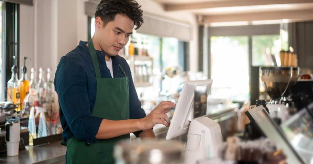Restaurant Staff taking order on POS