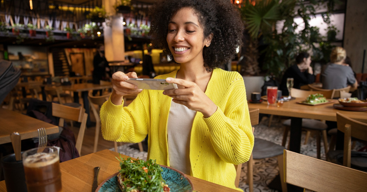 Women clicking picture of food