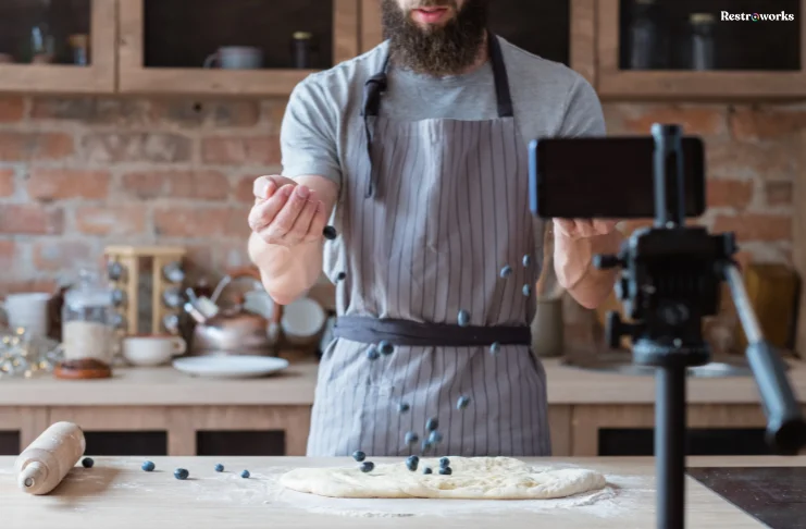 A man taking a video of baking