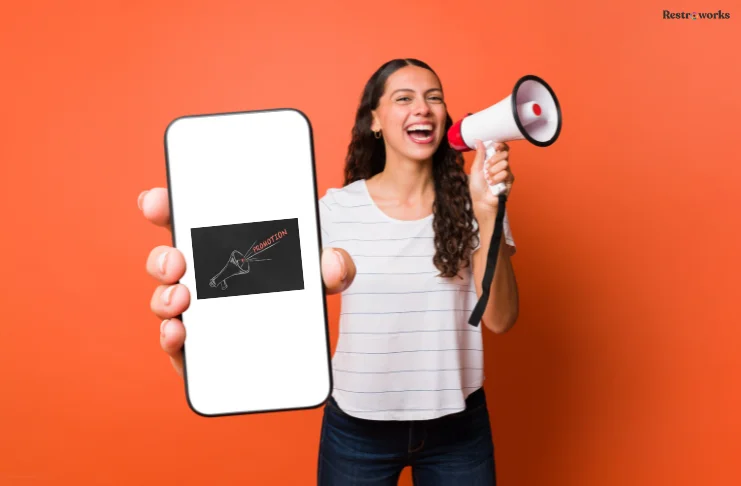 A girl with a megaphone and a phone