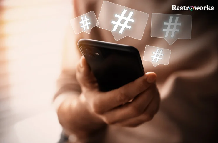 A graphic of hashtags popping out of a mobile phone.