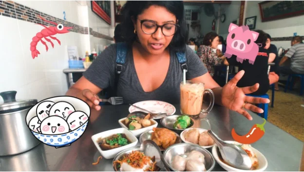 Photograph of a food blogger in a restaurant.