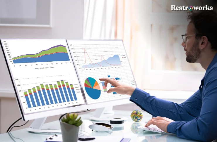 A man looking at analytics data representations