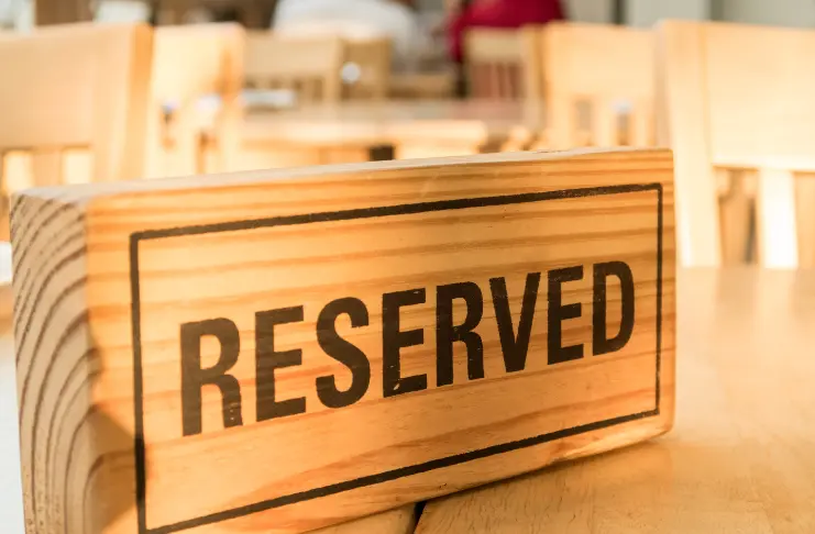 A wooden block with reserved written on it