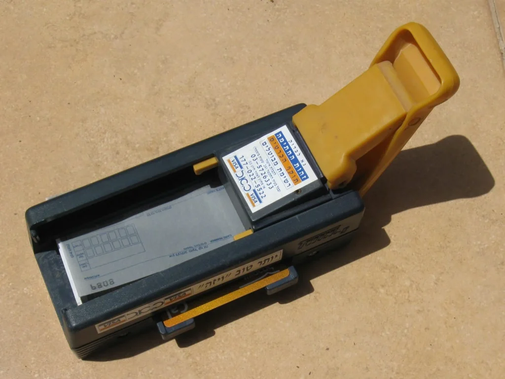 A Credit Card Imprinter used to record card details on paper