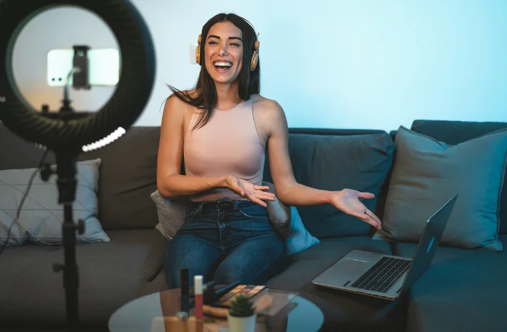 A woman recording herself for influencer marketing