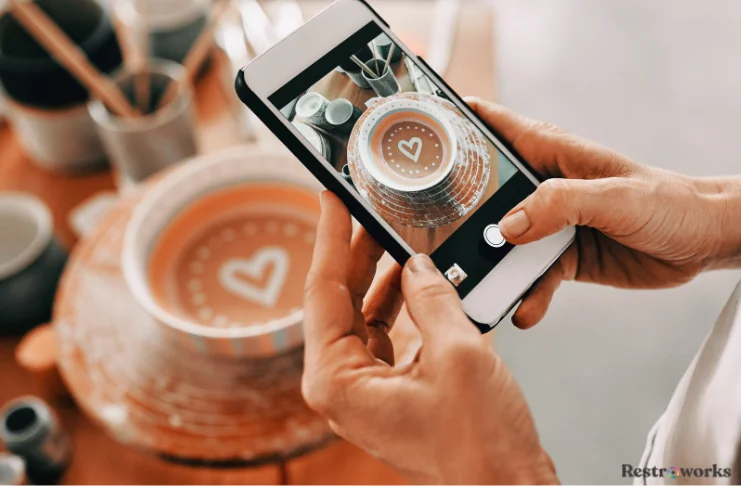 A phone taking a coffee photo for social media