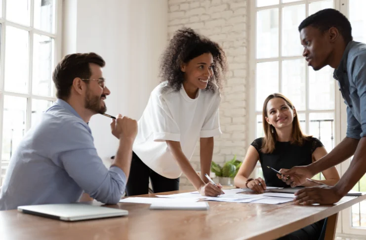 4 people discussing proposal