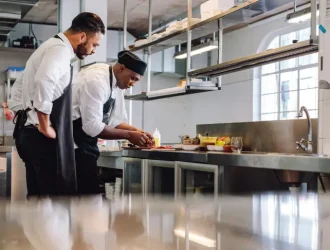 2 chefs preparing food