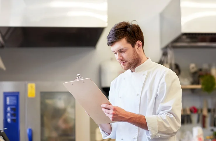 A man documenting inventory