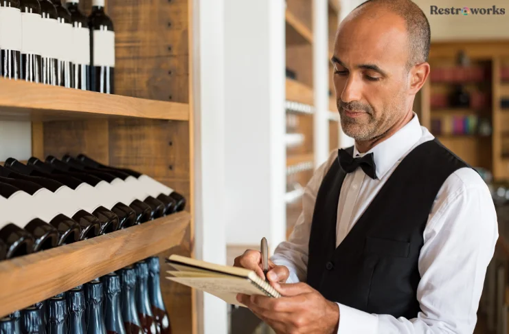 A man doing wine inventory