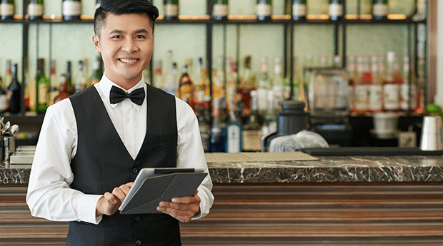 Restaurant staff holding a tablet