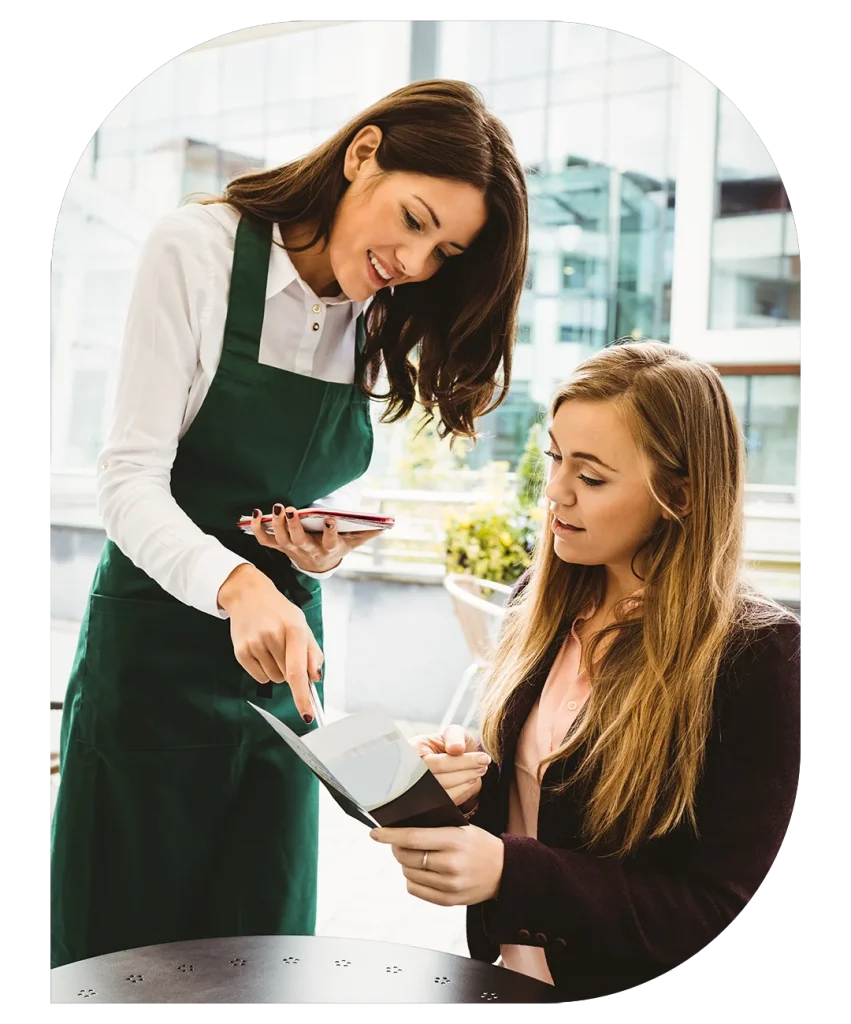 Restaurant staff taking order from customer
