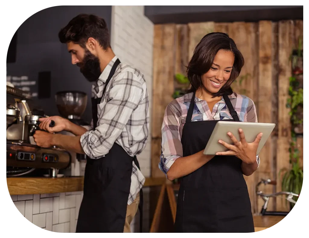 Cafe staff using restaurant analytics app