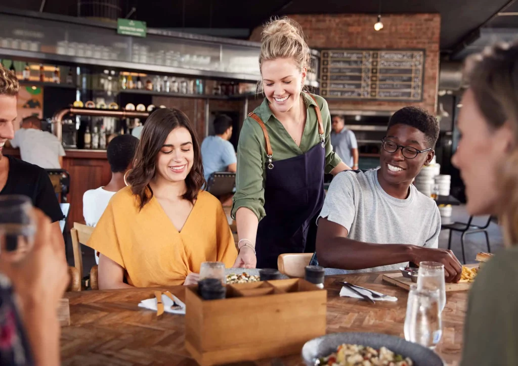 Restaurant staff serving customers