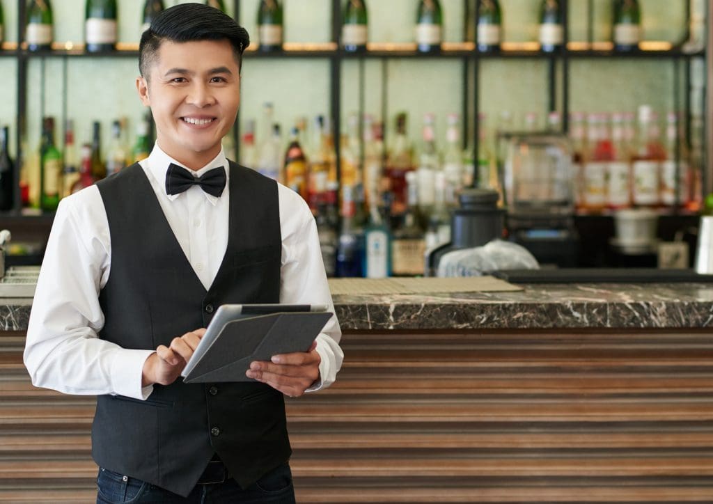 Restaurant staff using tablet ordering system