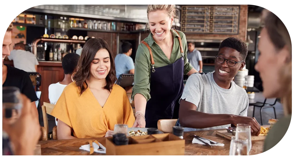 Restaurant staff serving customers