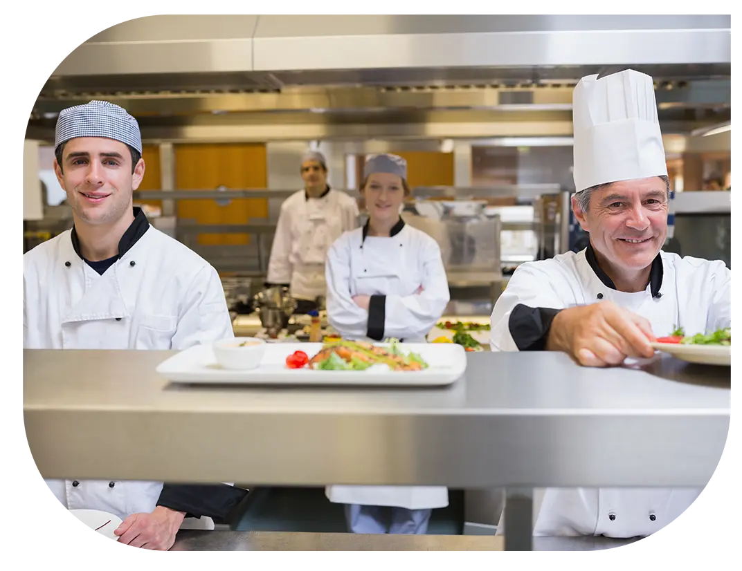 Kitchen staff presenting their dishes