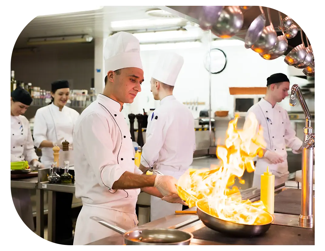 Kitchen staff working on preparing dishes