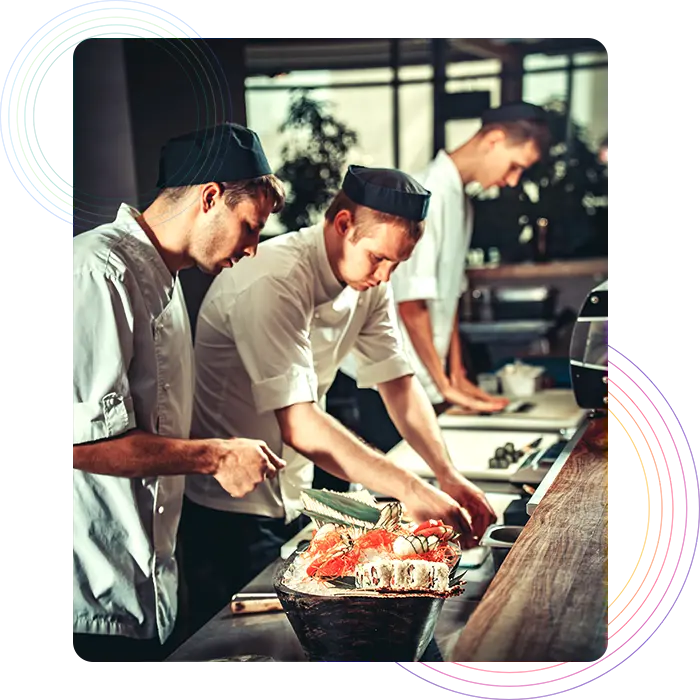 Restaurant chefs working on dishes