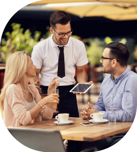 Restaurant staff taking orders through tablet ordering system