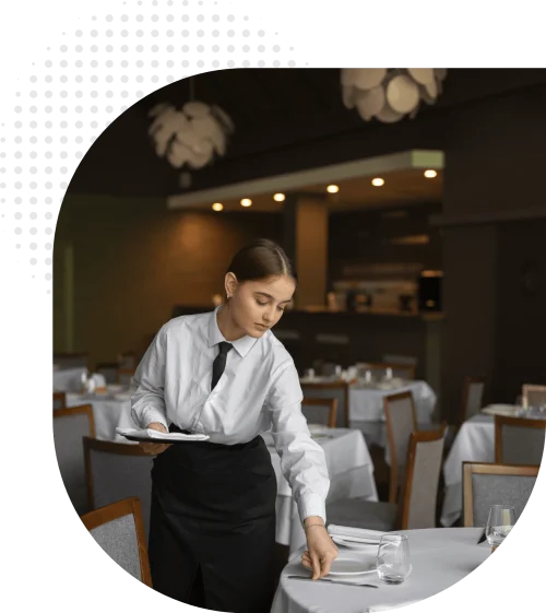 Restaurant staff preparing tables