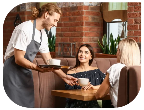 Cafe staff serving customers